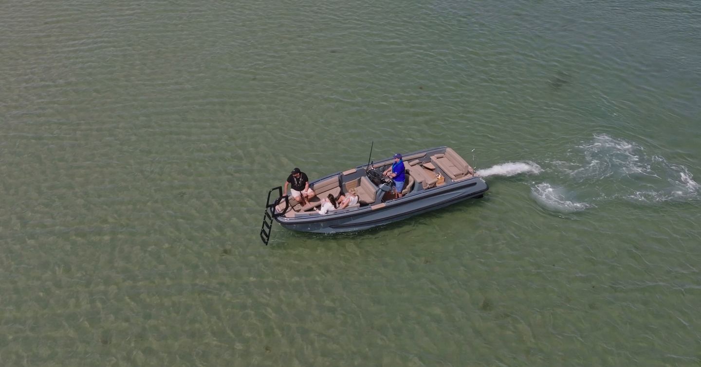 Evene Origin 71 approaching a shallow beach landing with bow ladder deployed