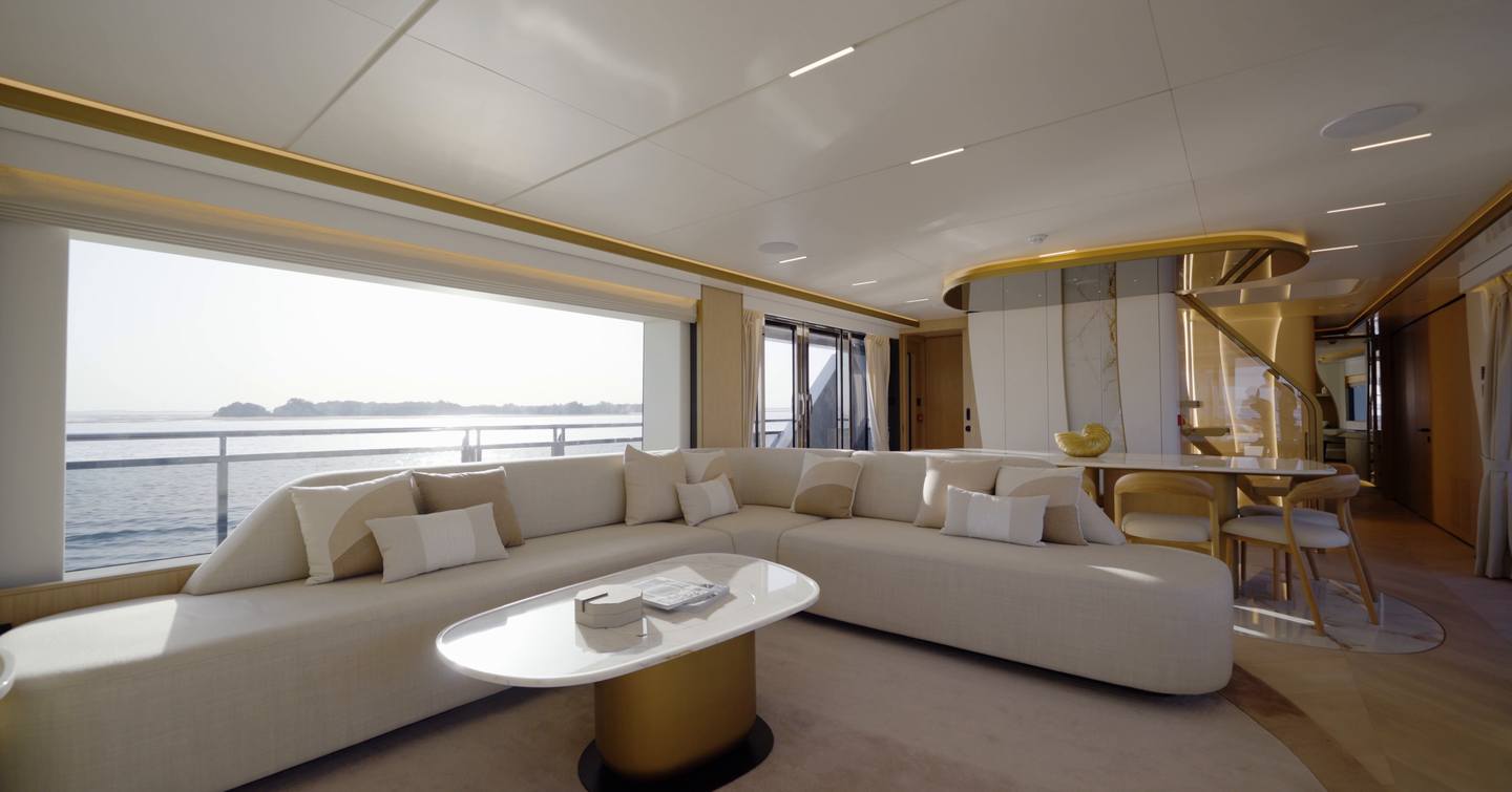 Main saloon on the Gulf Craft Majesty 100 Terrace with panoramic glazing and lounge seating