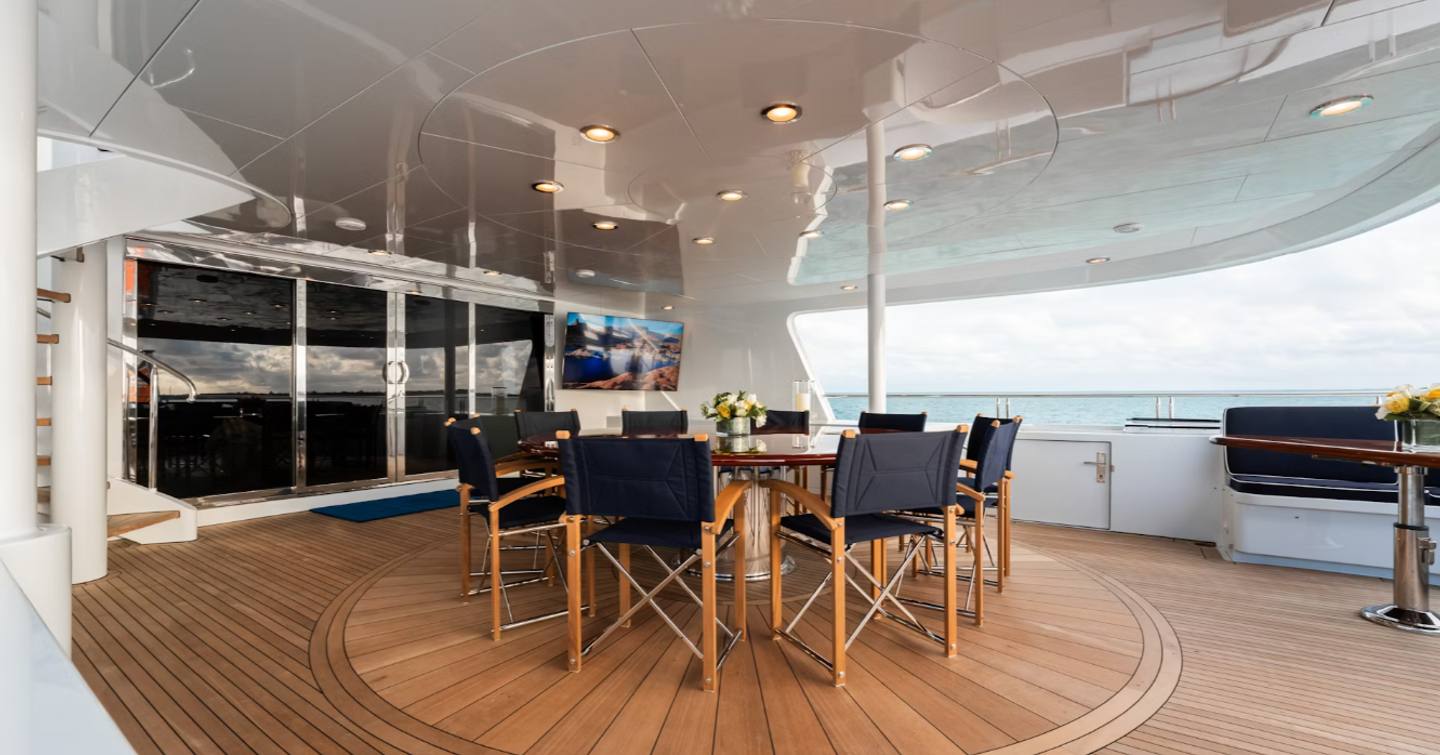 Superyacht Summer Dance main aft deck with shaded alfresco dining 