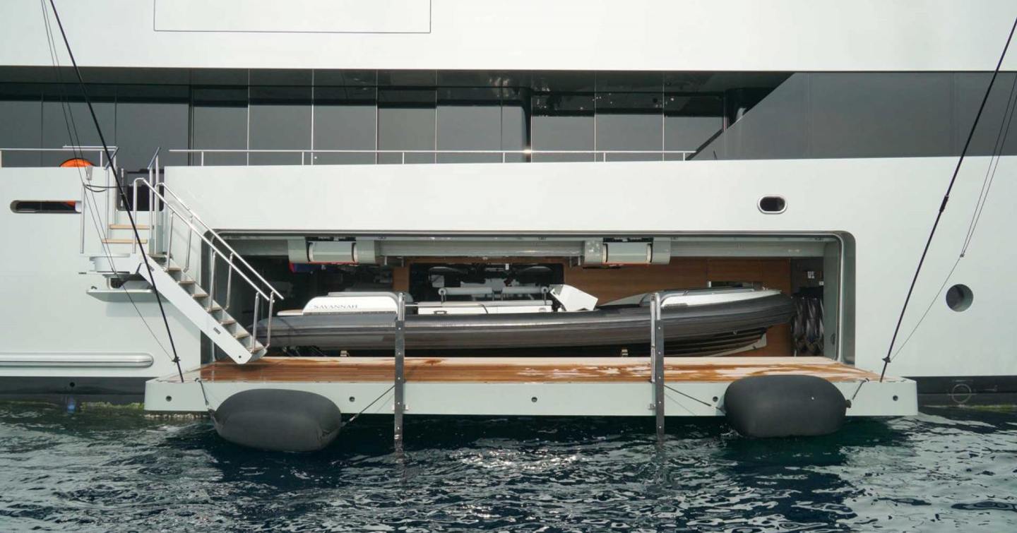 Tender in superyacht tender garage with platform down