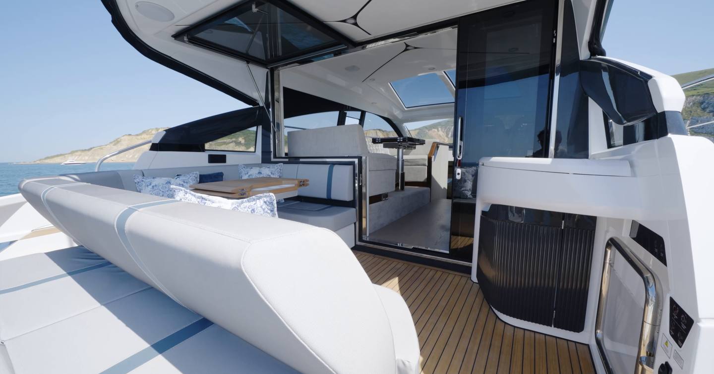 Cockpit seating and wet bar on the Fairline Targa 47 GT with the saloon doors open