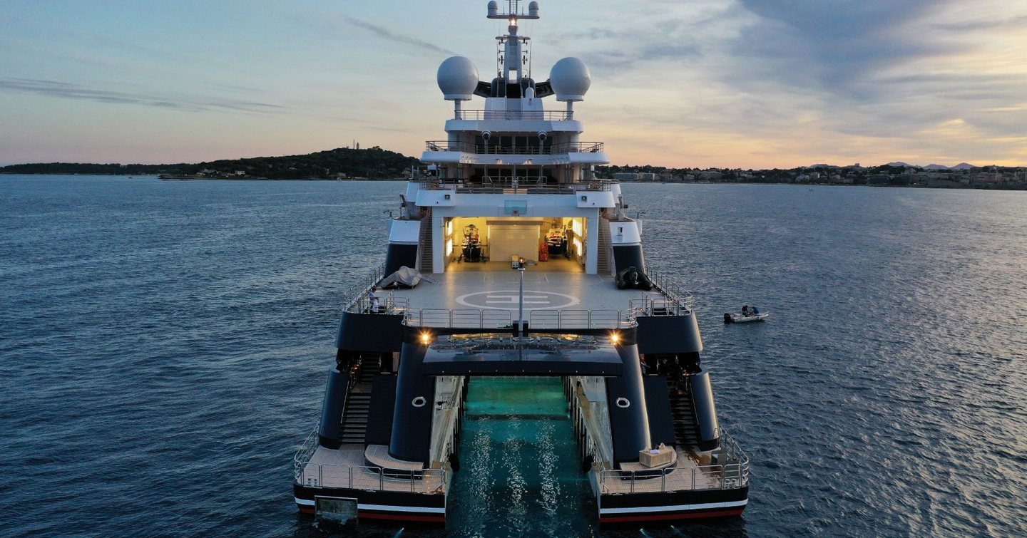 Stern with recessed cut-out of superyacht Octopus at anchor 