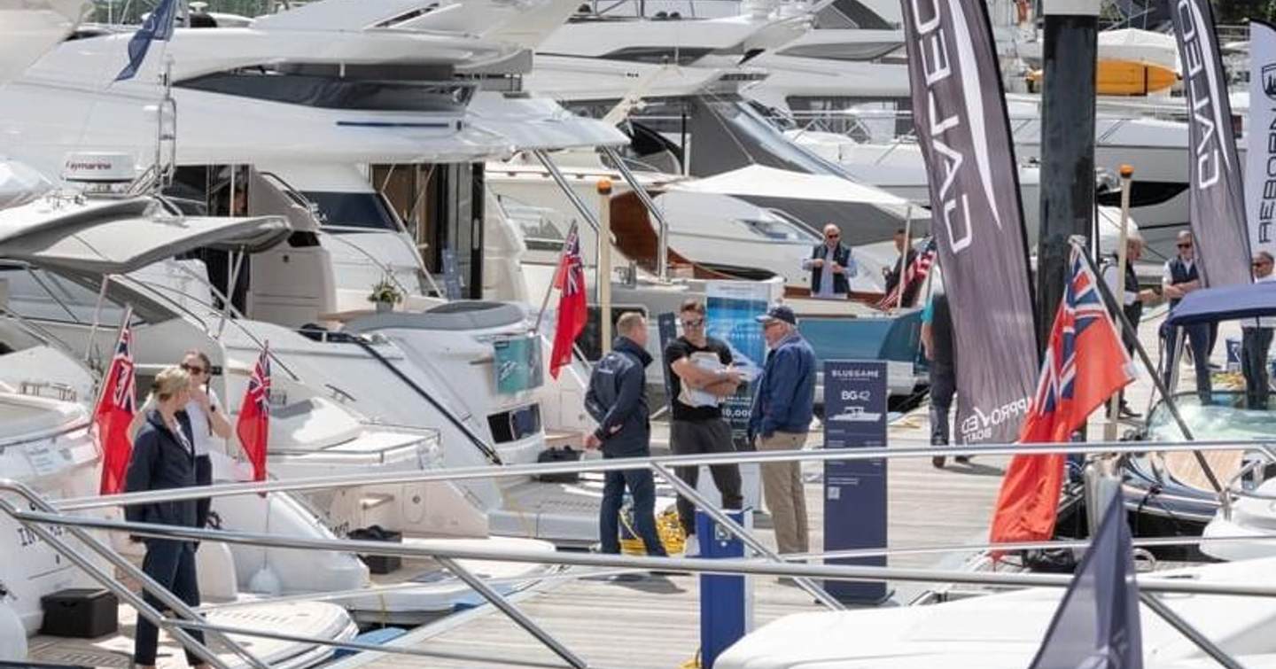 Display of motor yachts and visitors exploring at British Motor Yacht Show