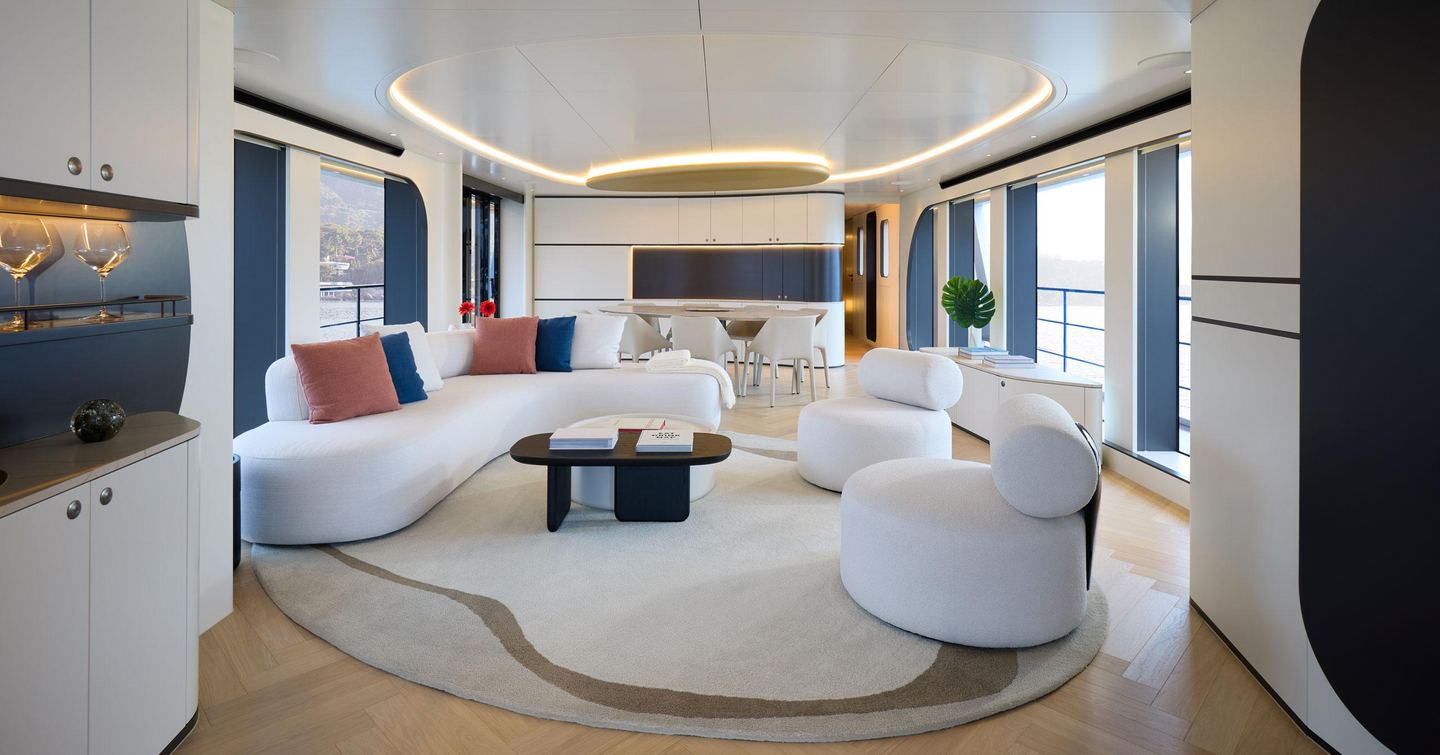 one main saloon with white sofas and dining area