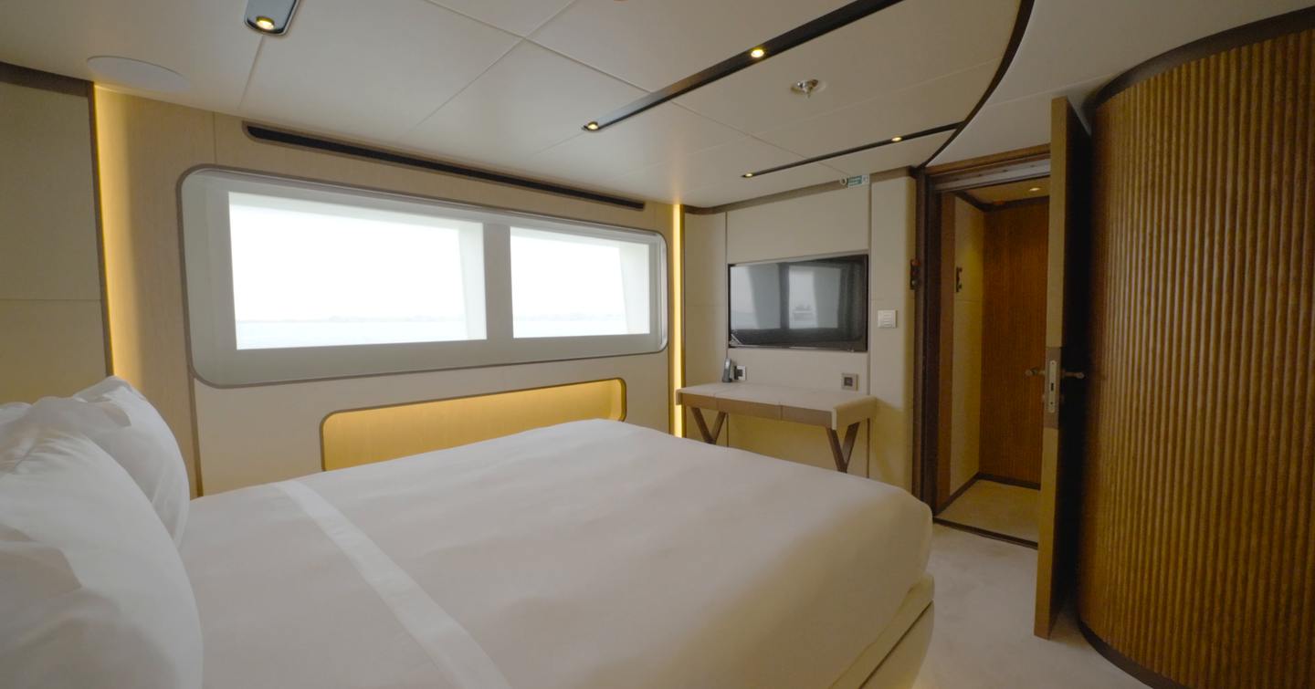 VIP guest cabin aboard the Gulf Craft Majesty 145 with hull window, double berth and ensuite access
