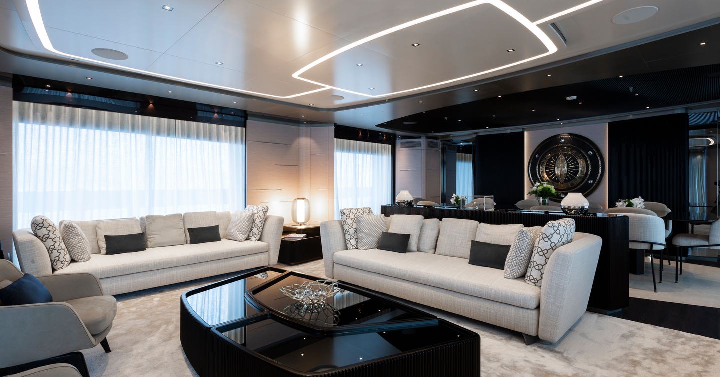 Superyacht Diamond Binta saloon with dining area and coffee table