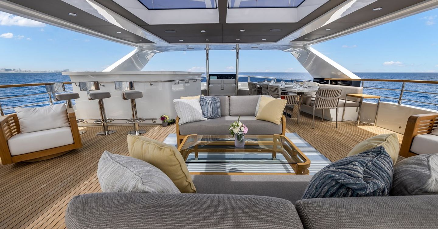 Superyacht Evelyn P's sundeck with shaded seating, bar area and alfreso dining
