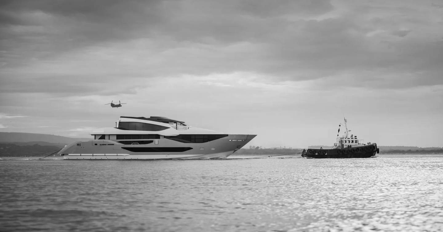 Sunseeker 134 Superyacht following tugboat in black and white 
