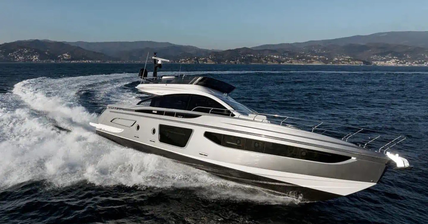 Running shot of Azimut S7 underway, with land in far distance in background.