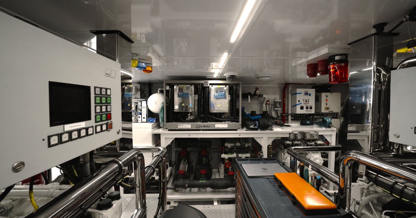 Benetti Oasis 34M engine room with twin MTU diesel engines, technical systems and full-height access between machinery spaces.
