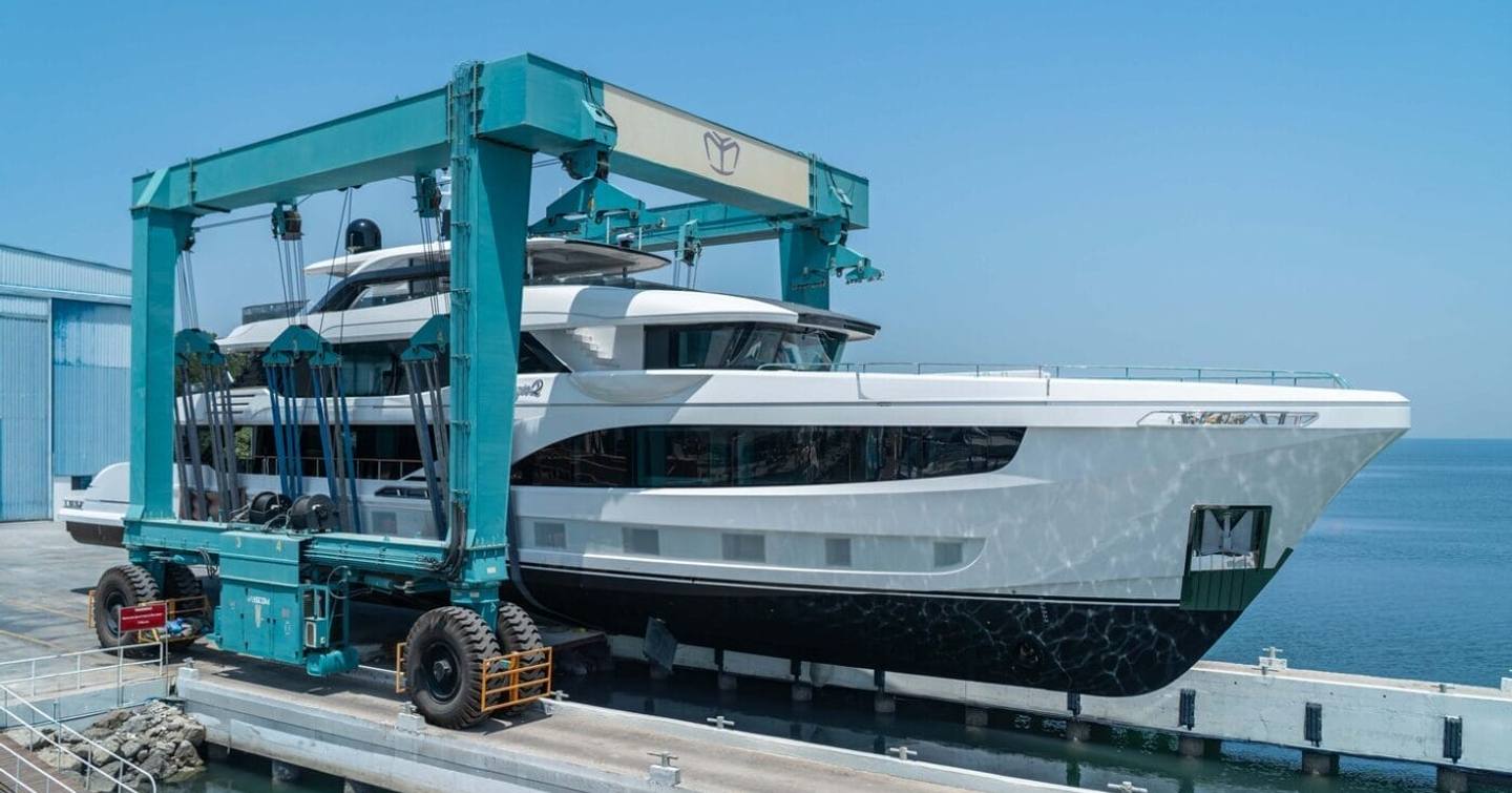 Gulf Craft Majesty 145 superyacht in the travel lift during launch at the Gulf Craft shipyard in the UAE