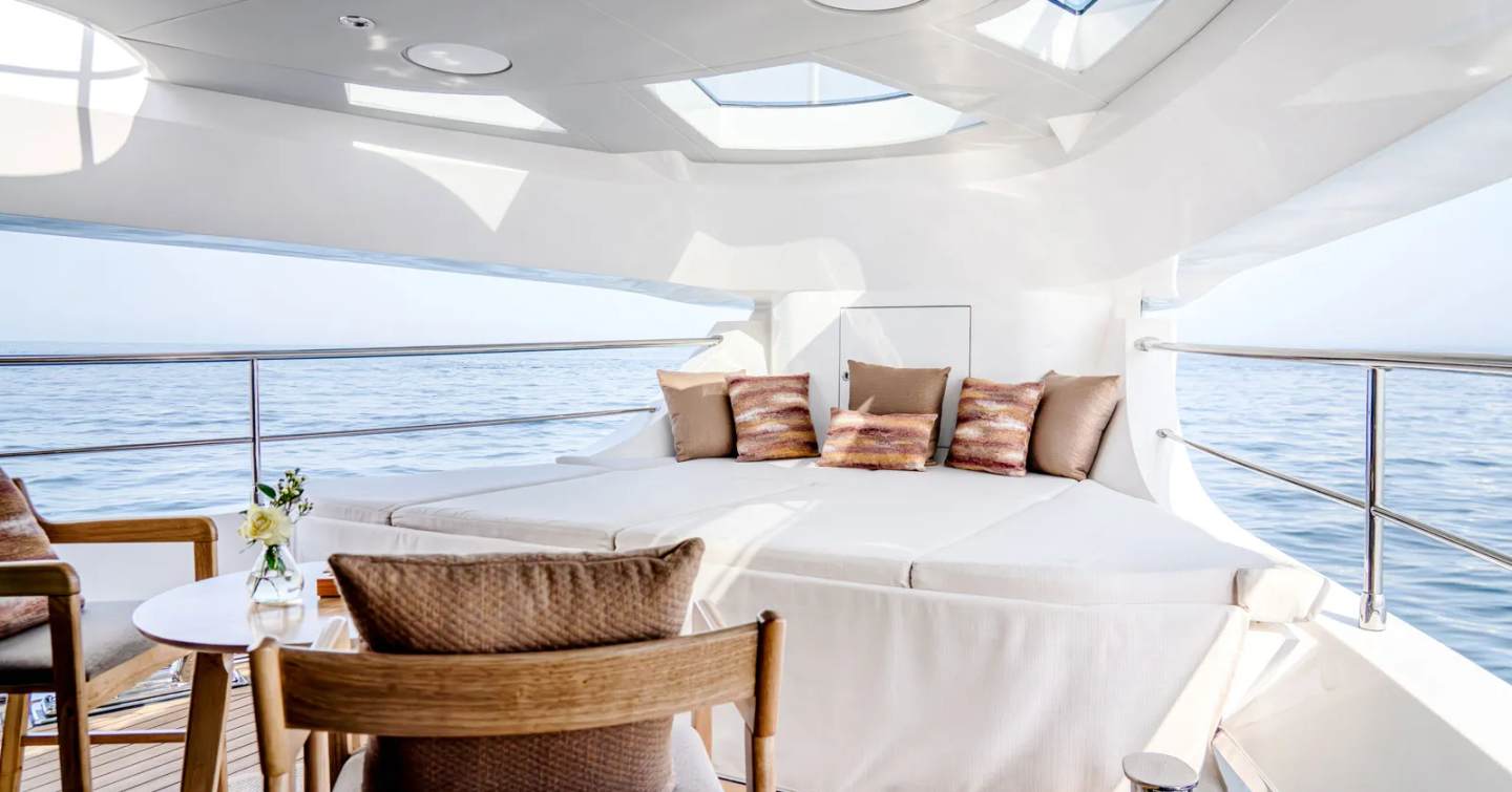 Gulf Craft Majesty 100 motor yacht private owner's terrace with sunpads and coffee table