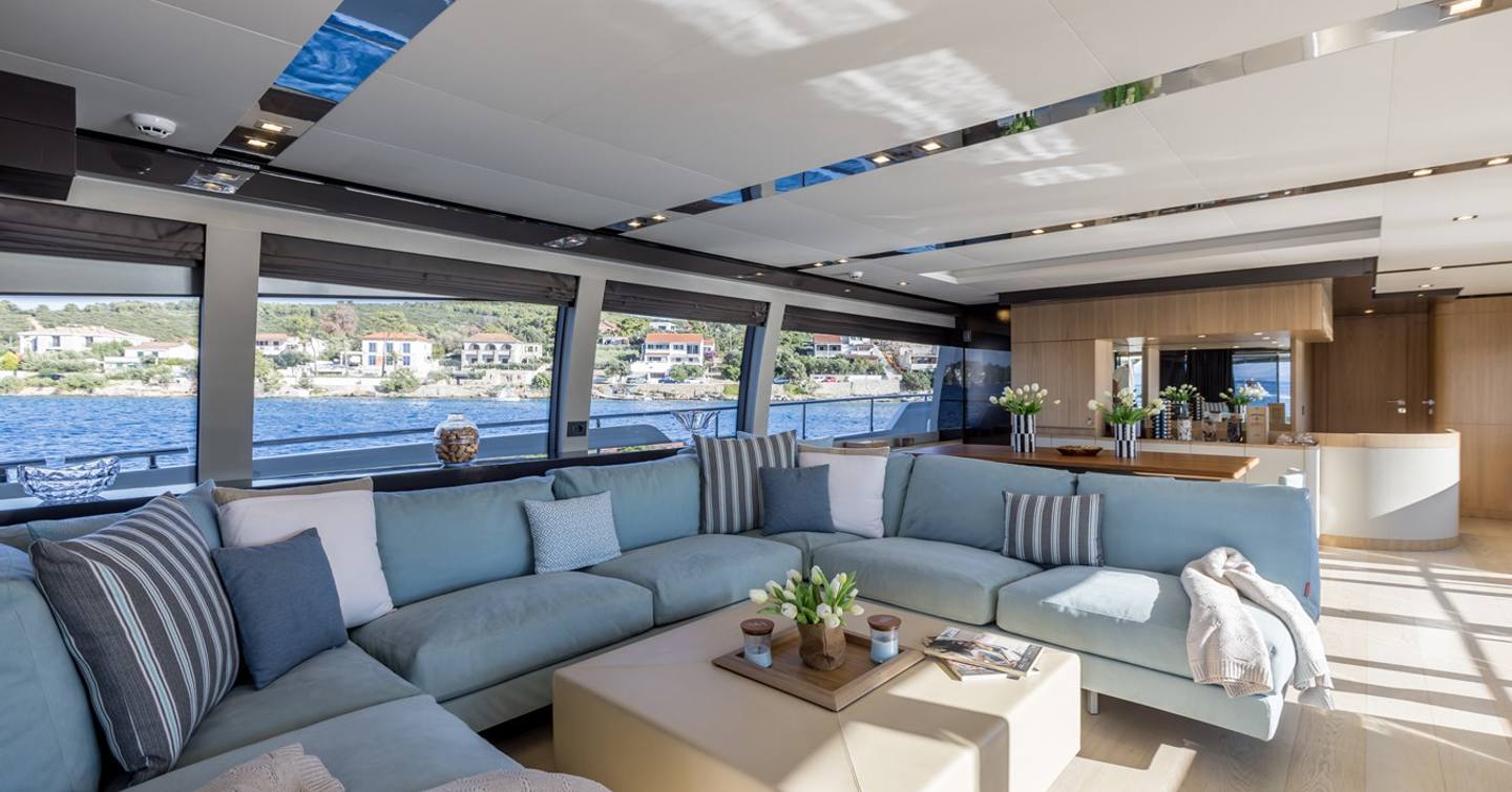  Motor Yacht Katariina X0's main saloon with U-shaped sofa and coffee table 