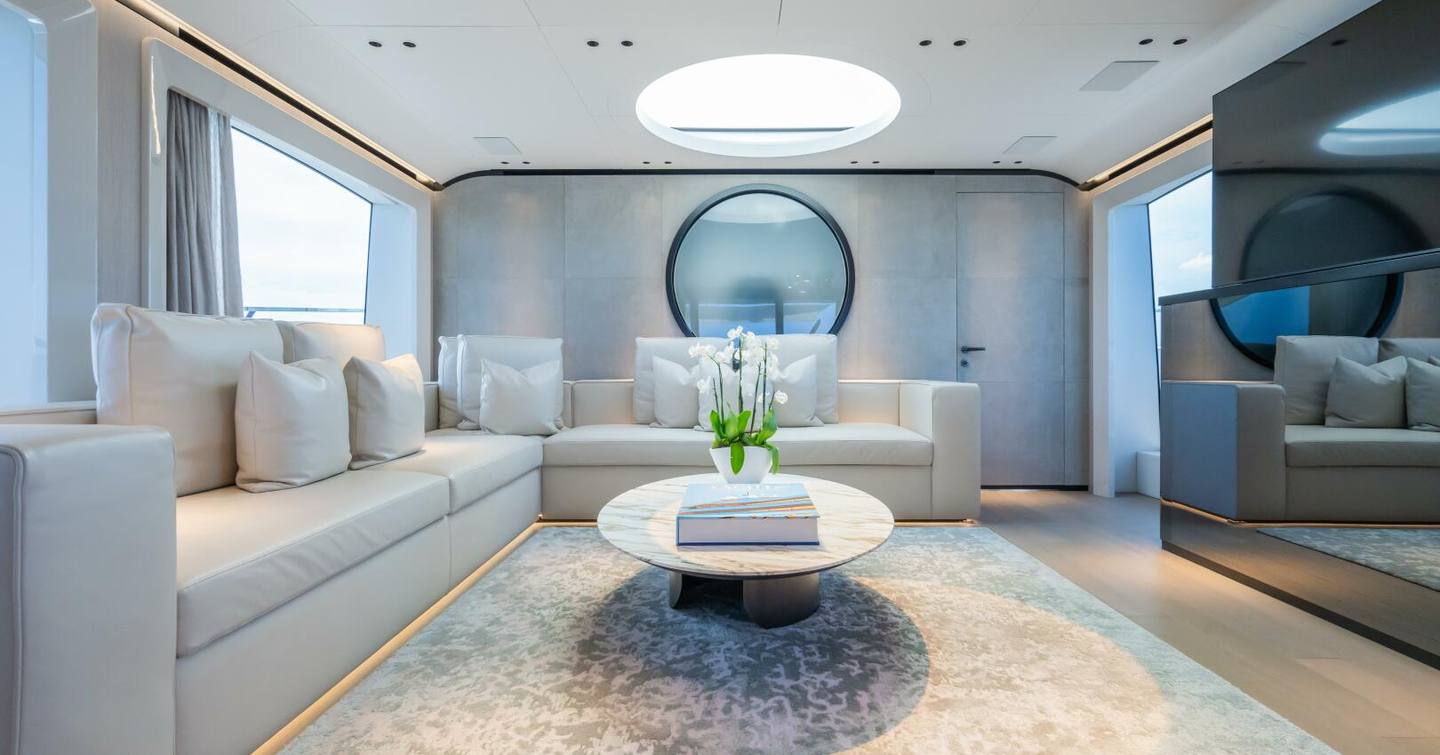 Motor Yacht Jacqpot main saloon with L-shaped sofa