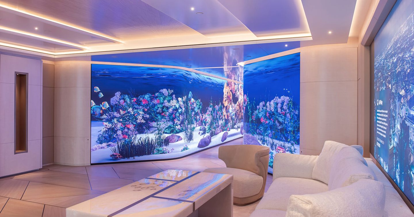 Aquarium onboard superyacht H3 with plush seating in the foreground.