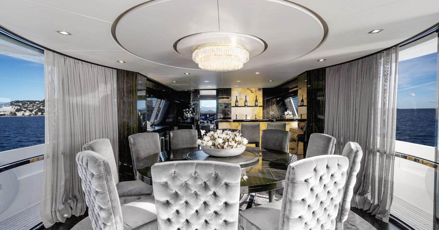 Motor Yacht Yvonne interior dining area with circular table