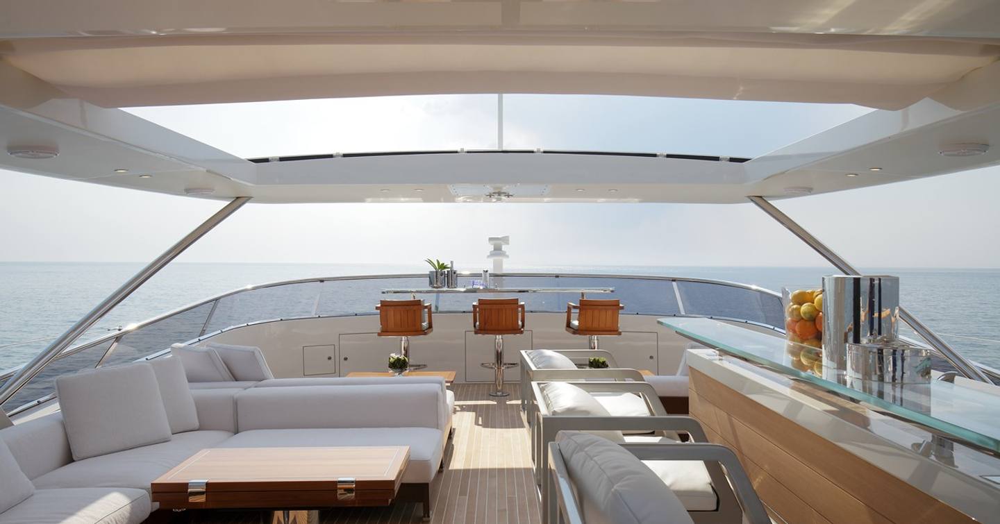 Superyacht Inspiration flybridge with shaded seating and bar area