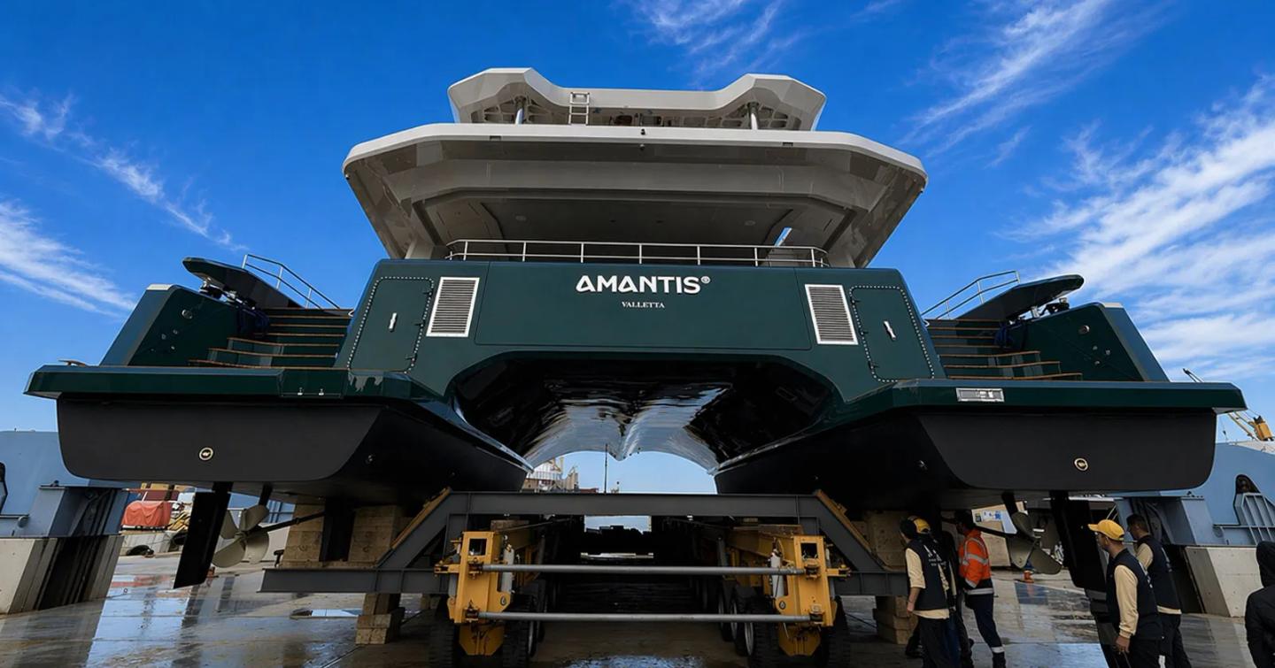 Workers underneath Sunpower-Alva 90 Solar Electric Catamaran Amantis 7