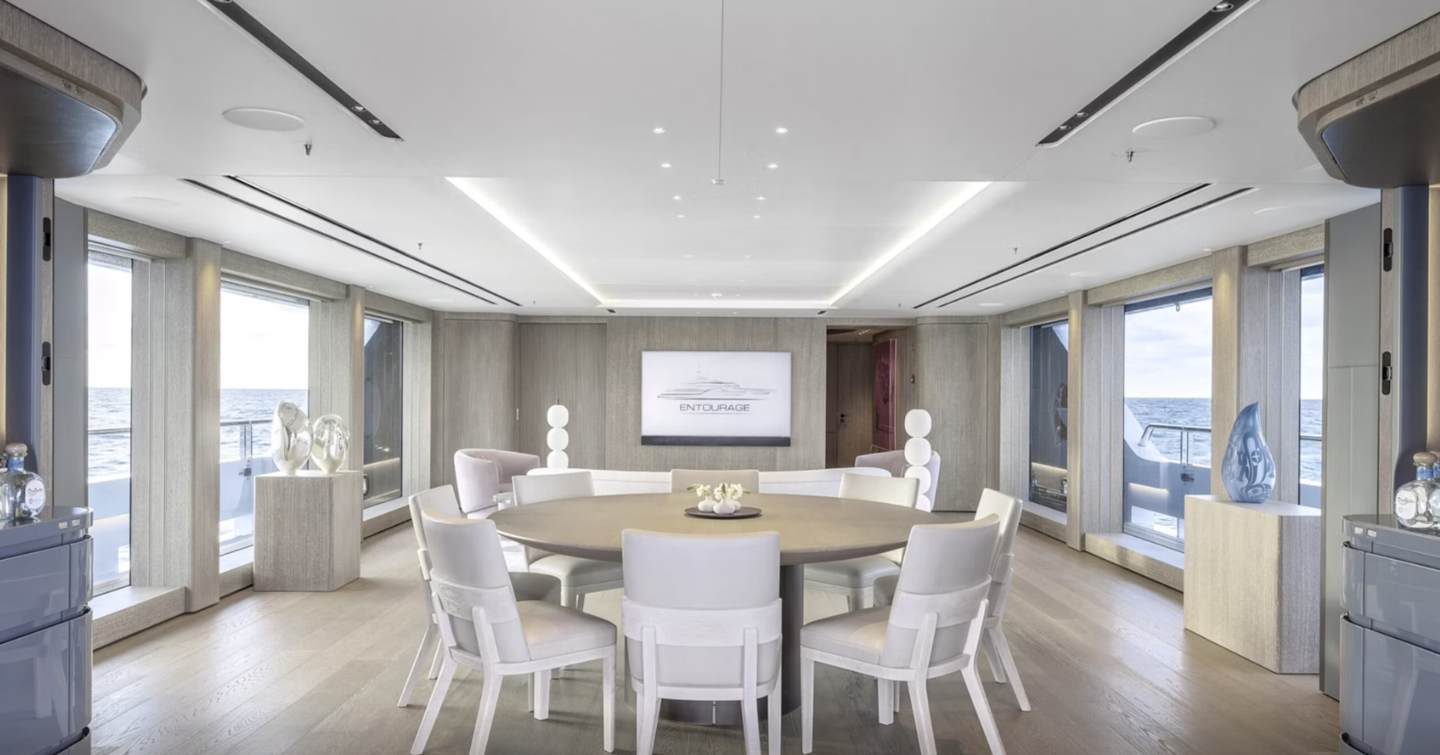 Rendering of Superyacht Entourage interior circular dining area 