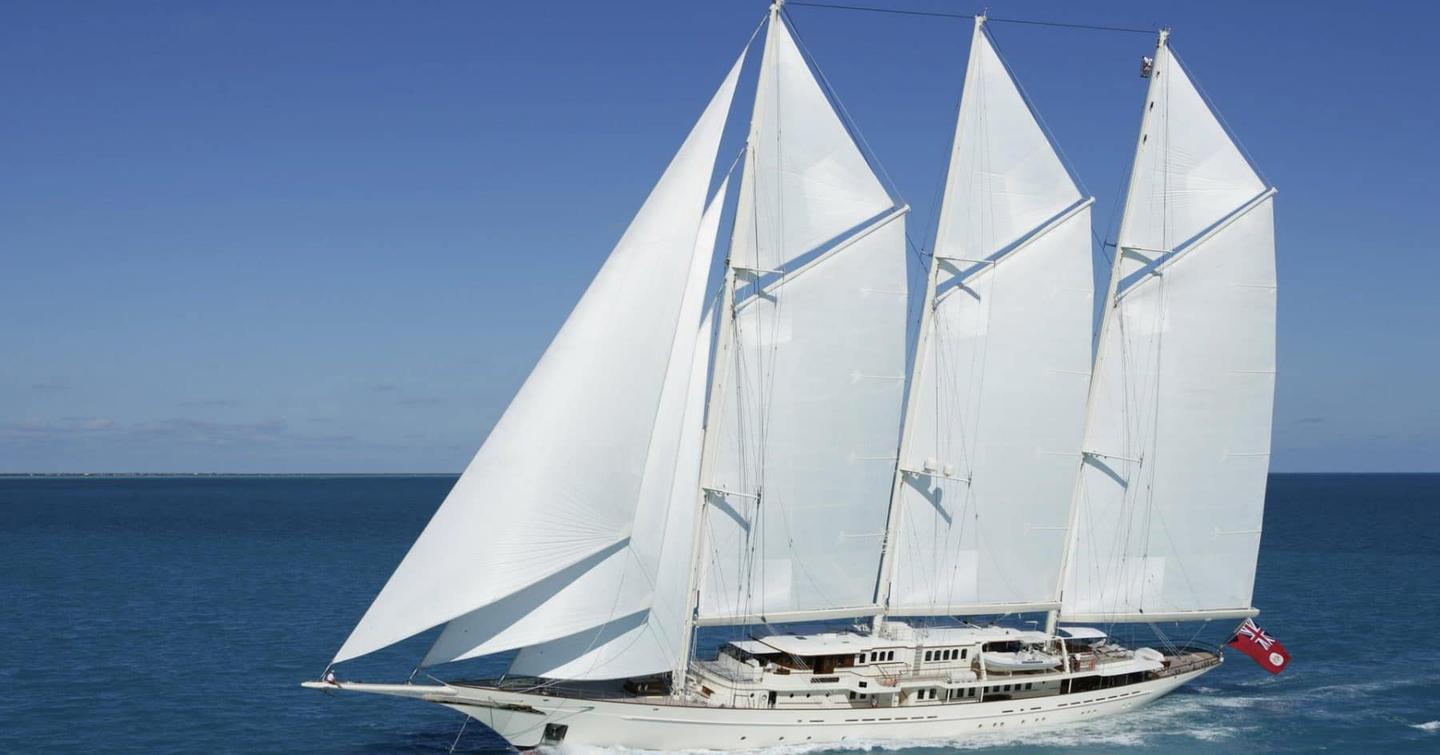 Side view of Sailing yacht ATHENA underway, surrounded by sea.