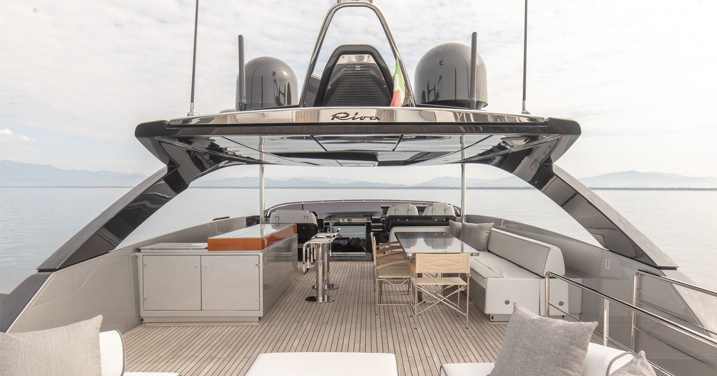Motor Yacht T57's flybridge with shaded seating and bar area