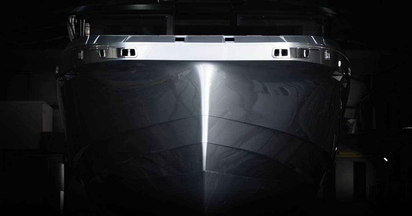 Bow of Superyacht Atlantide in dark in shed 