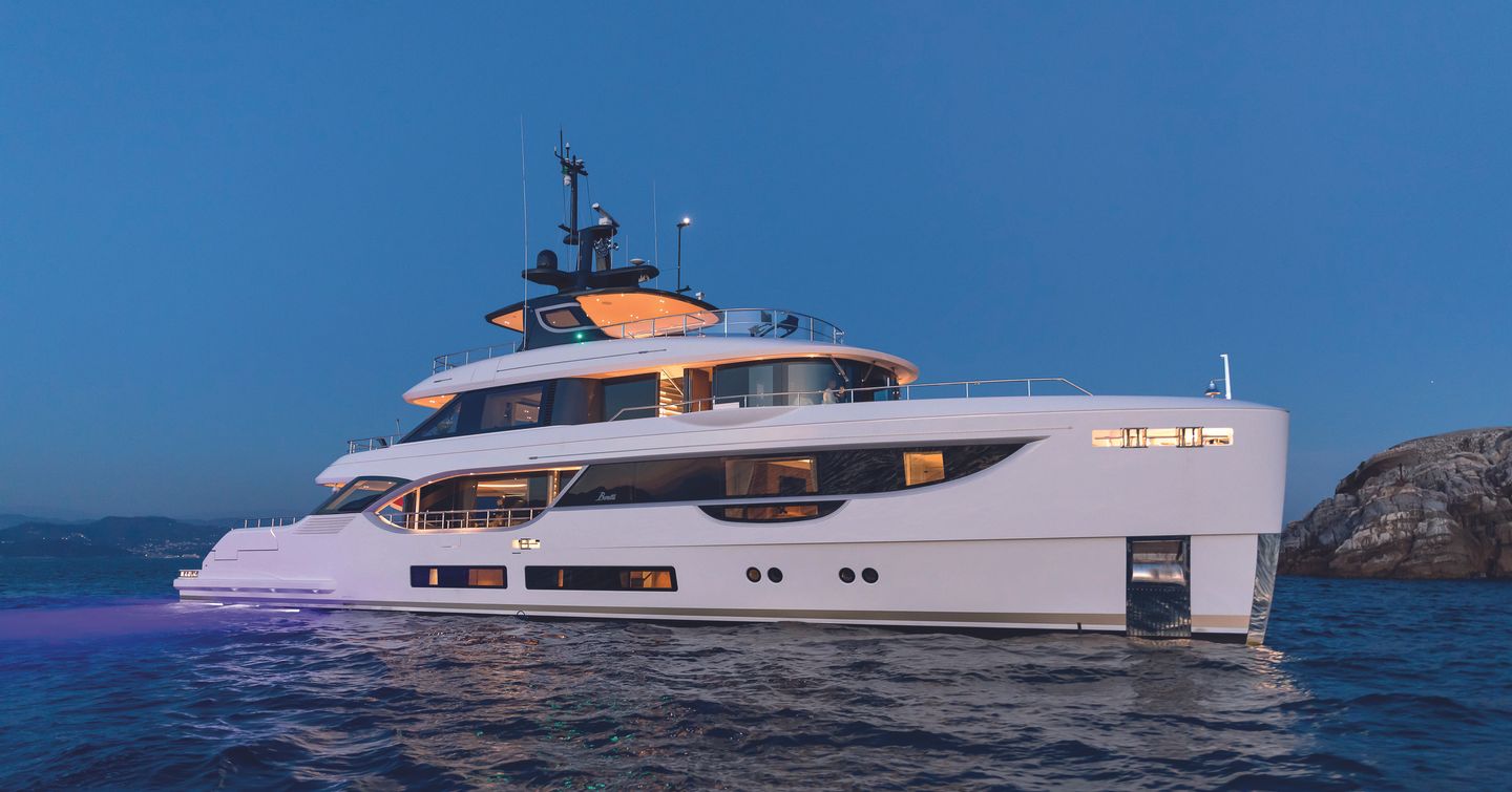 Benetti Oasis 34m superyacht at anchor with underwater lights