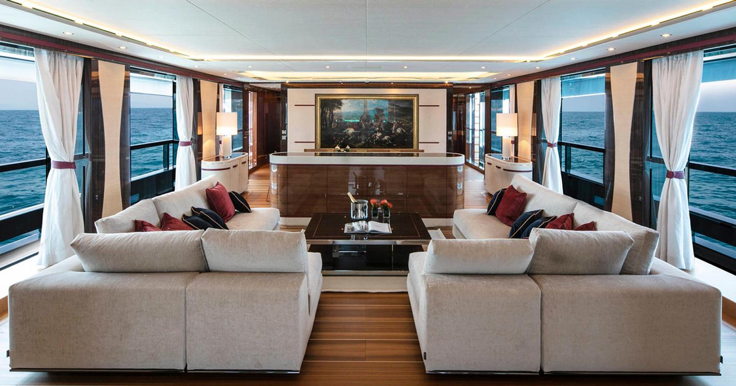 Mangusta GranSport 54 superyacht main saloon with dual l-shaped white sofas