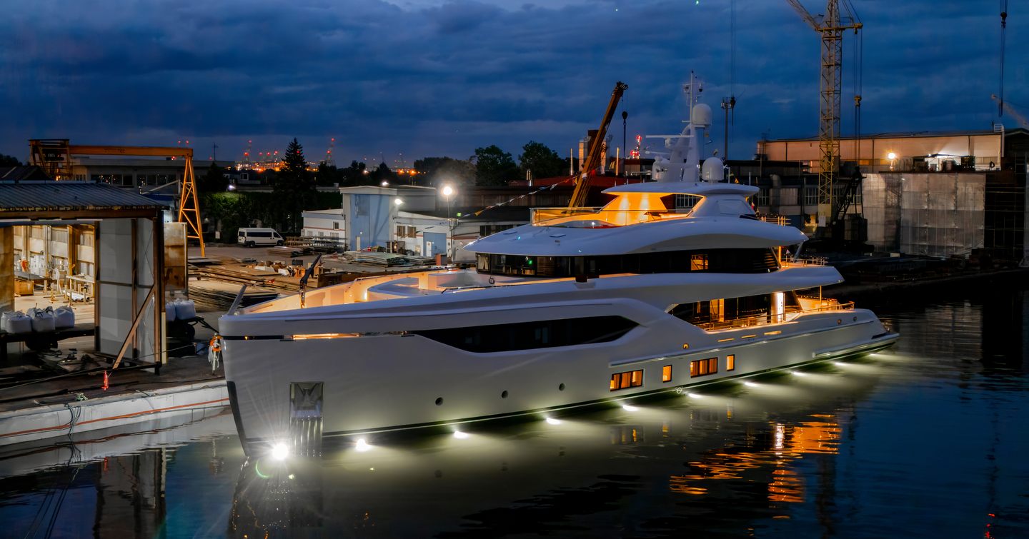 Superyacht Miss Leen at launch at night with underwater lights and warm interior LED's 