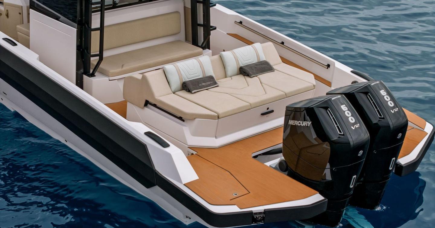 Technohull XPD 46 boat aft deck with sunpads and outboard engines