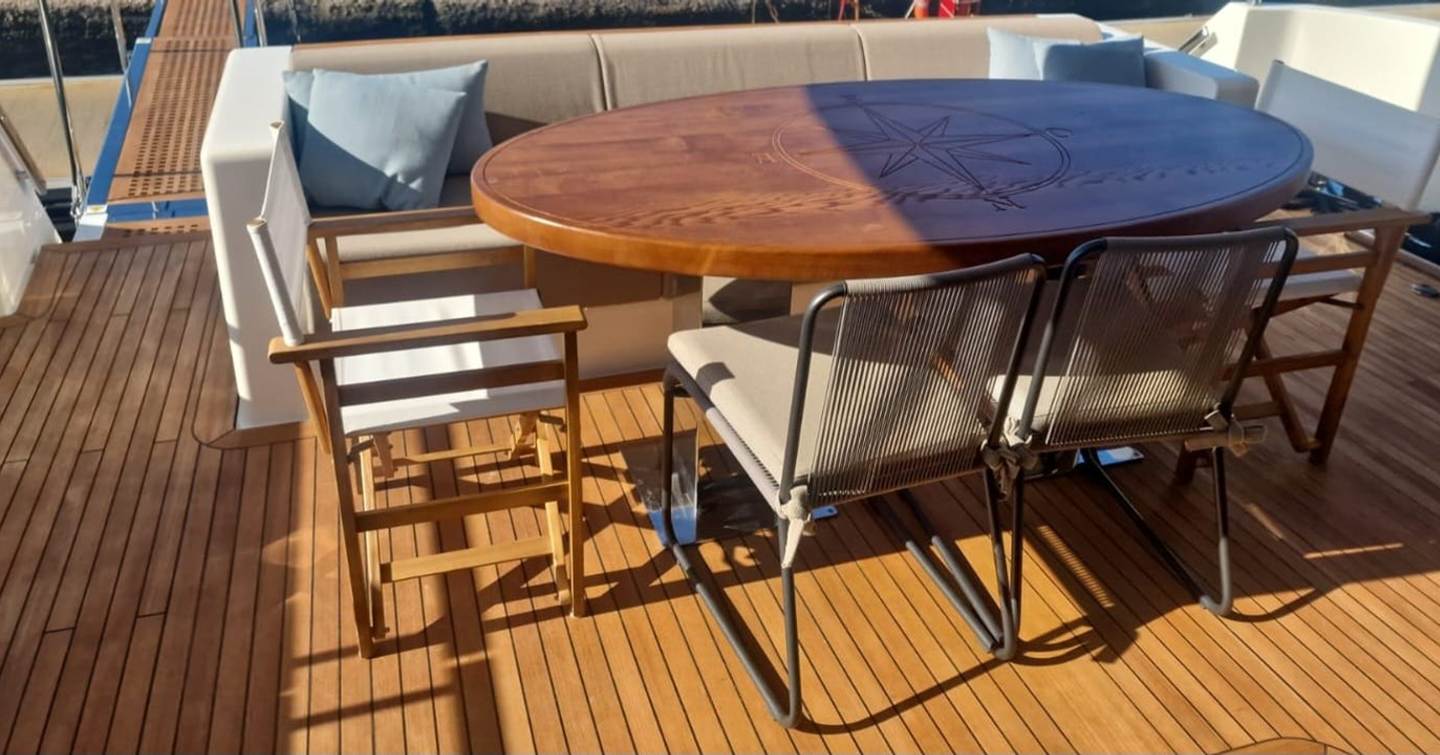 Motor yacht Alhambra I aft deck wooden table 