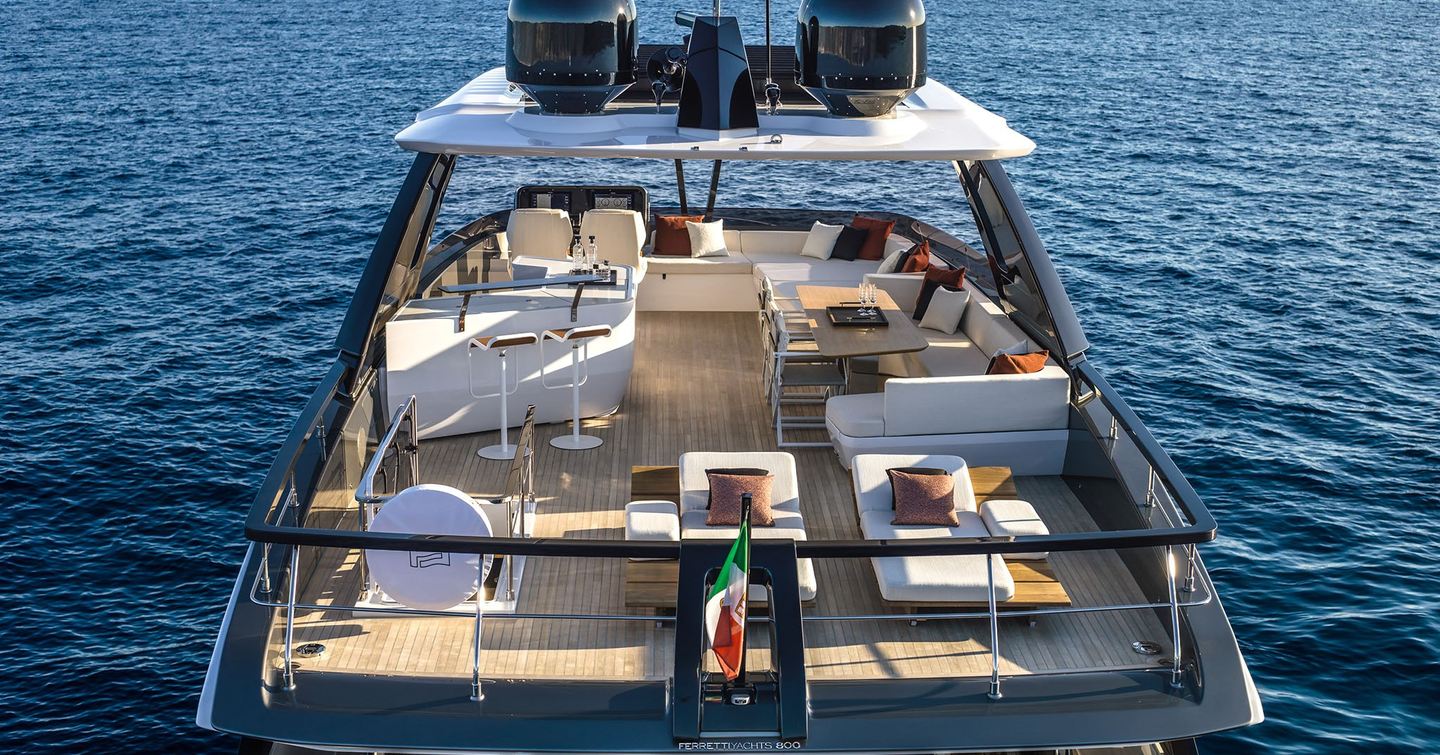 Ferretti 800 motor yacht flybridge with shaded U-shaped seating and bar area 