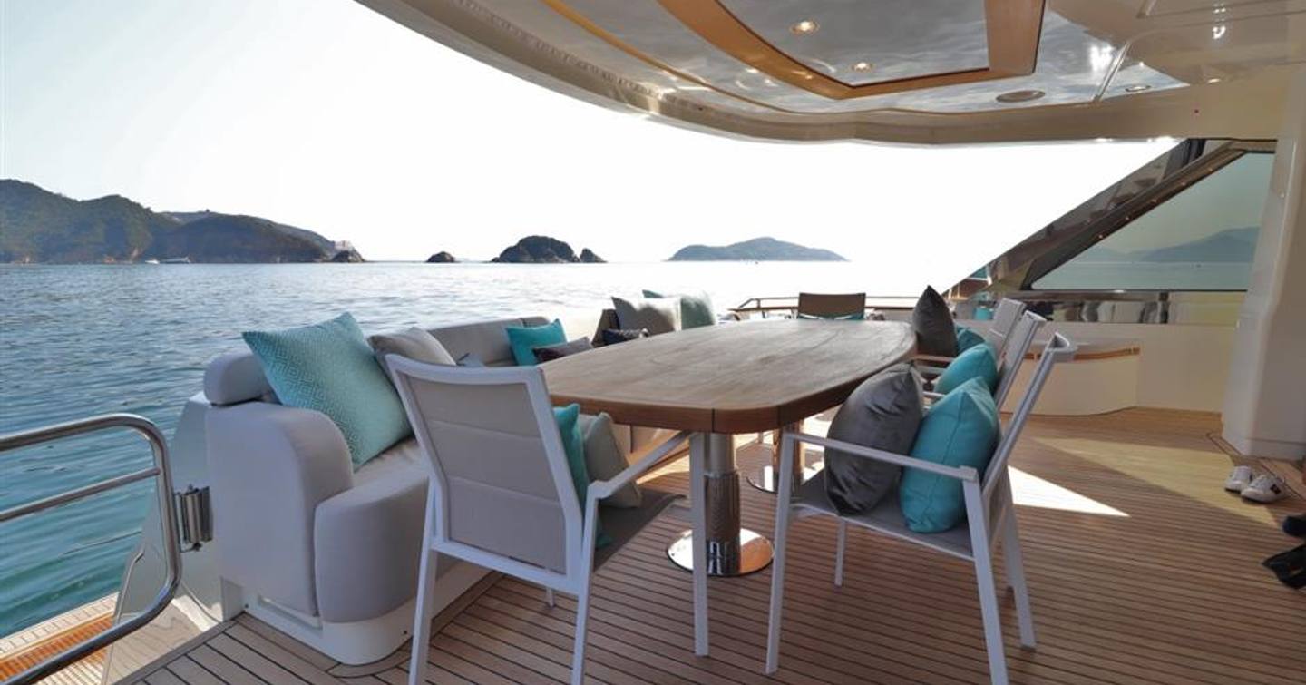 mcy 86 dining arrangement on aft deck of flybridge yacht