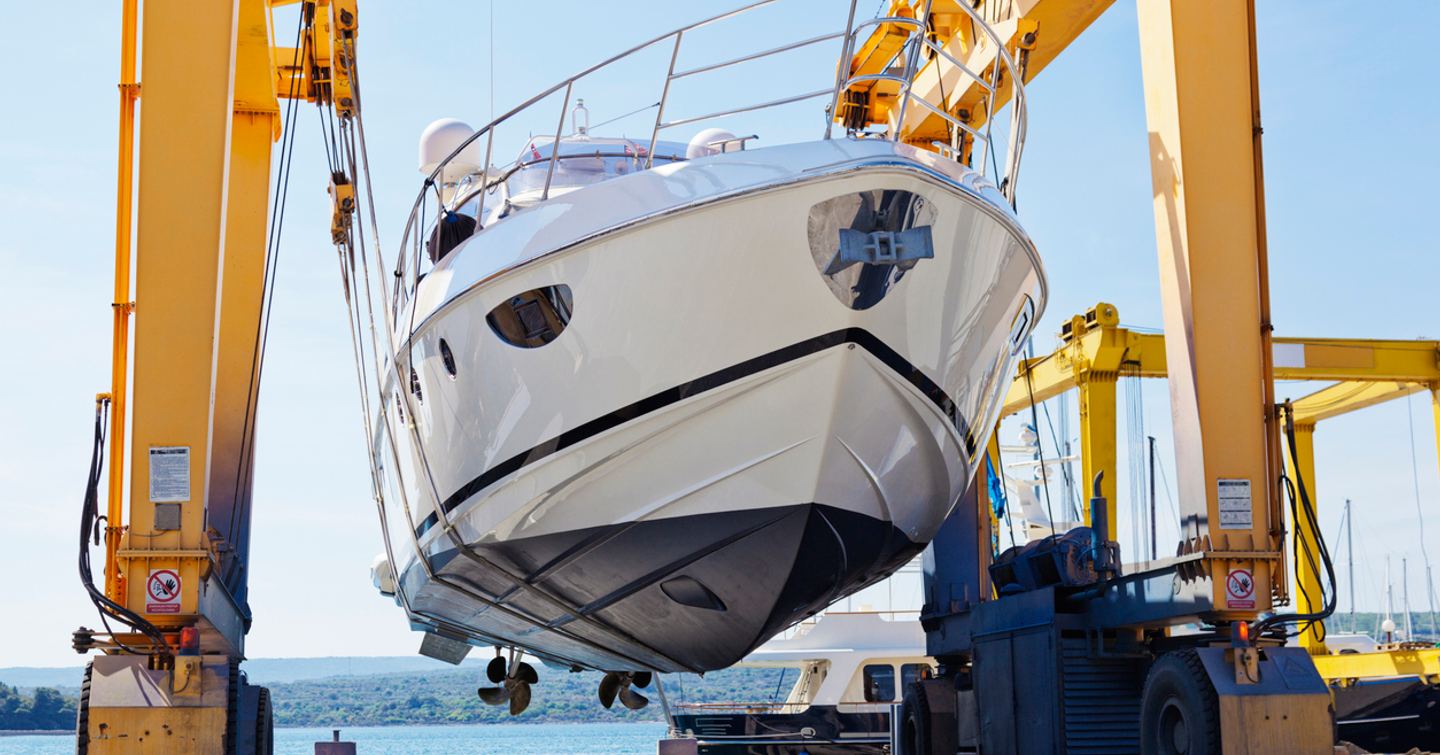 yacht in a boat lift for a survey