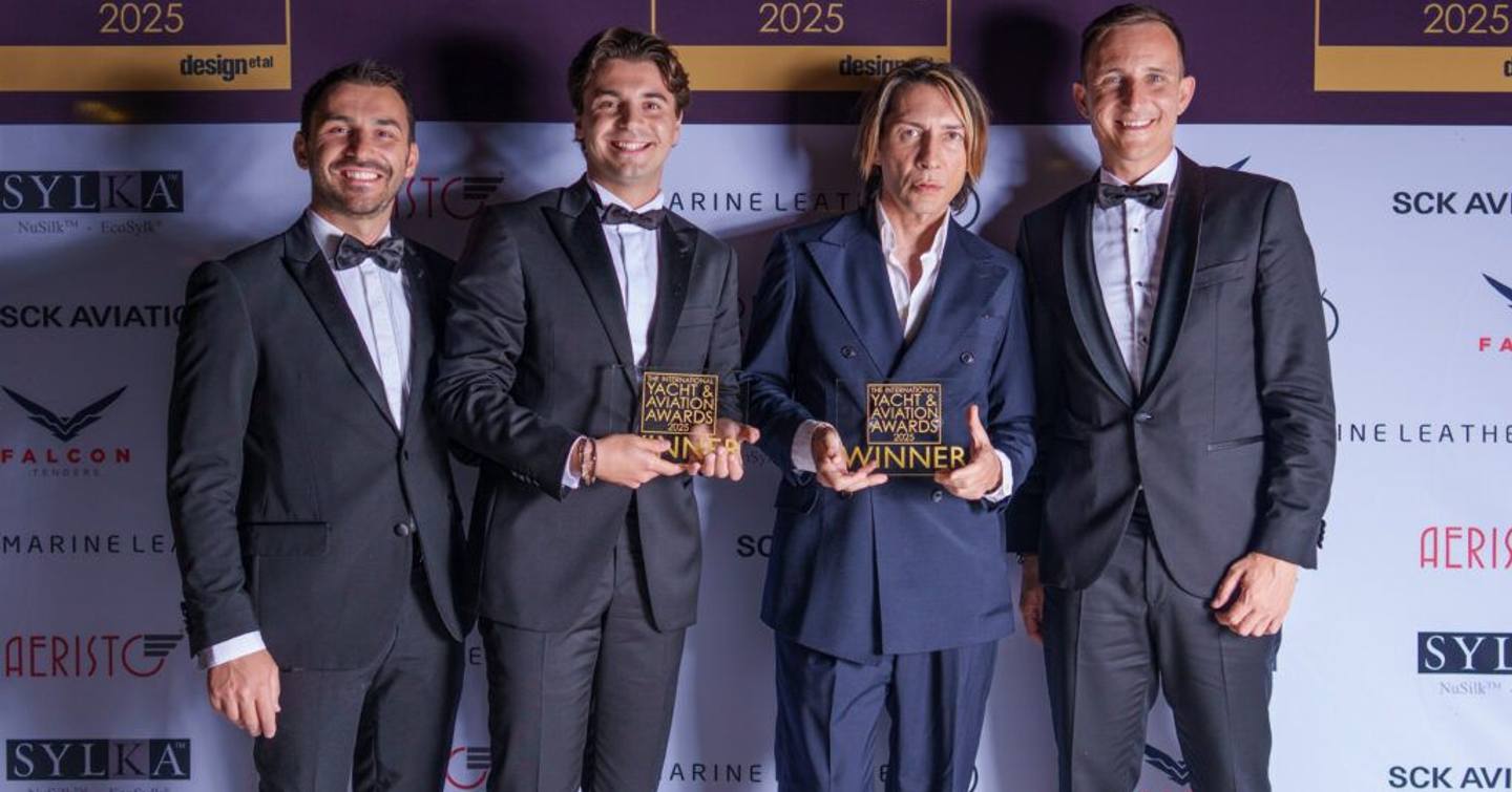 Representatives from Admiral Yachts with trophies