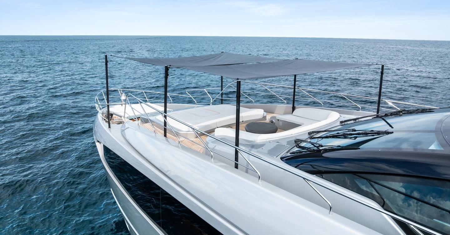 Superyacht Riva Royale foredeck with U-shaped seating and attached canopy