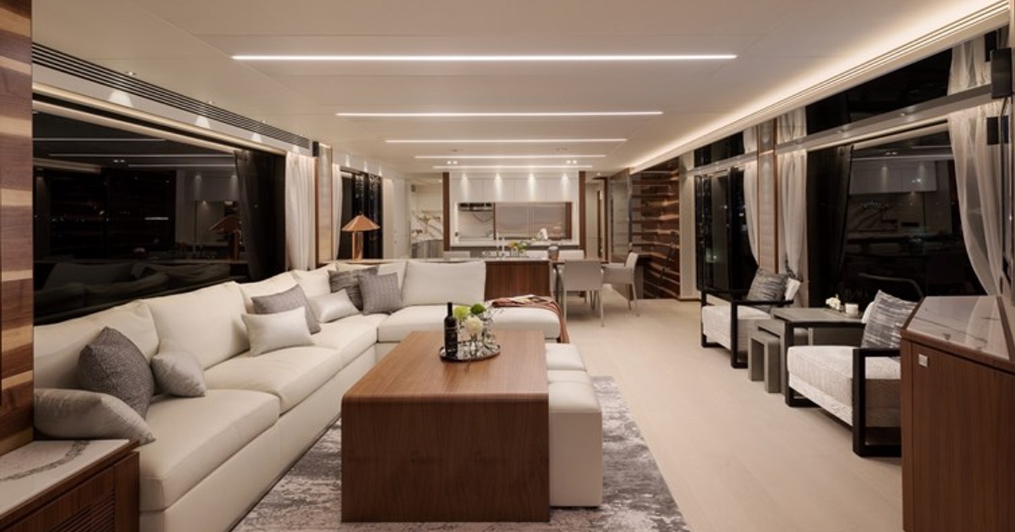 Motor Yacht Genesis' main saloon with L-shaped sofa