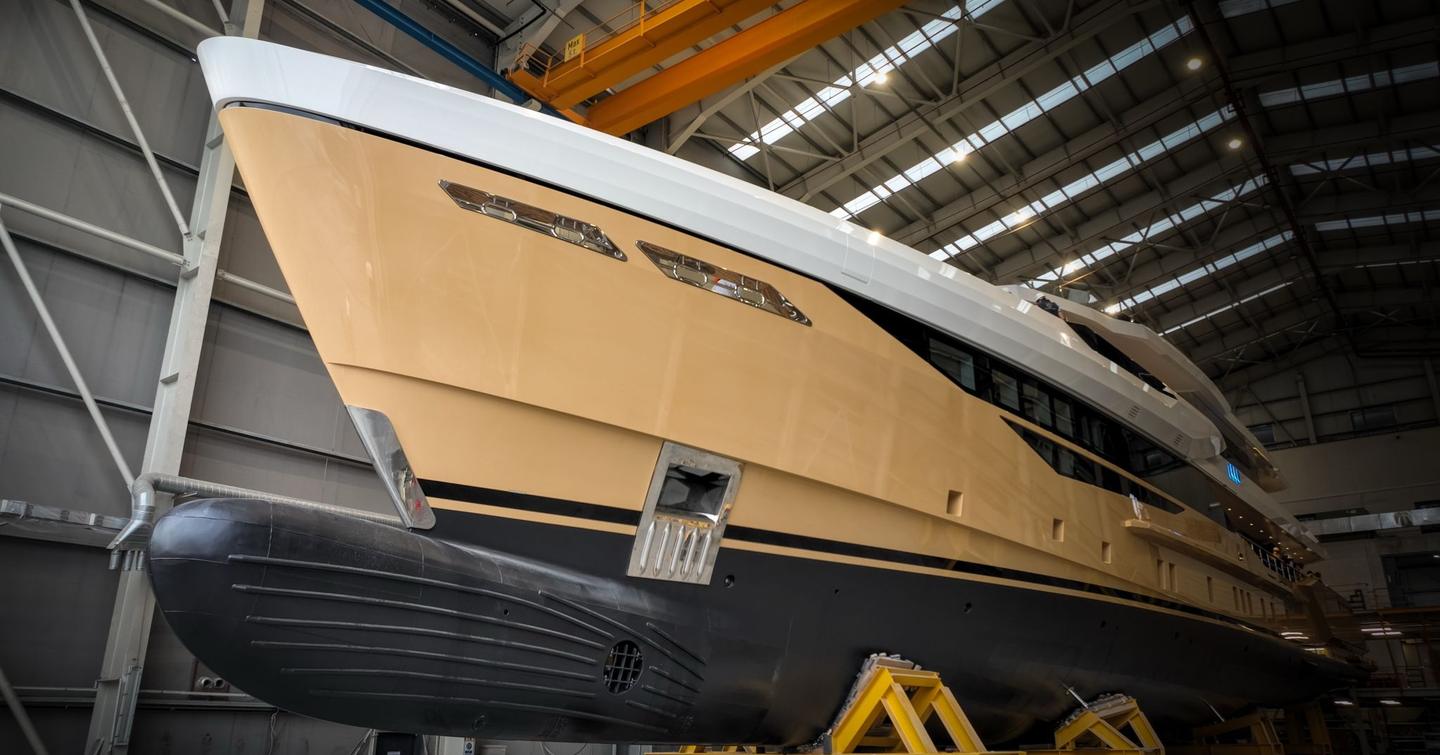 Close up of motor yacht Tamasha's bow in yard before launch