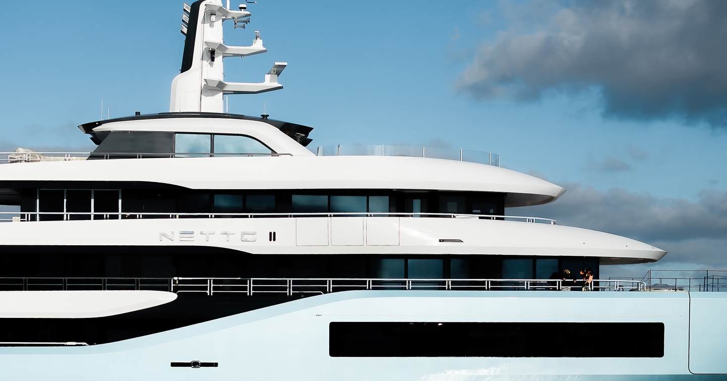 Close up of Amels 80 Superyacht Netto II superstructure with blue hull