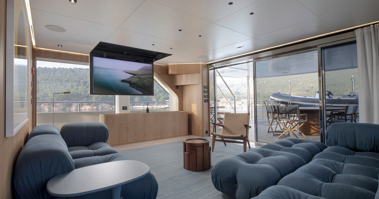 Explorer Yacht Cabana skylounge with fold down TV and blue seating