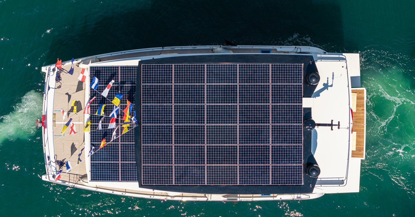 Aerial view of VisionF 65 Catamaran with solar panels 