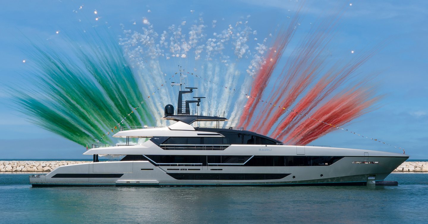 Superyacht Sairu at launch with multicoloured confetti behind her