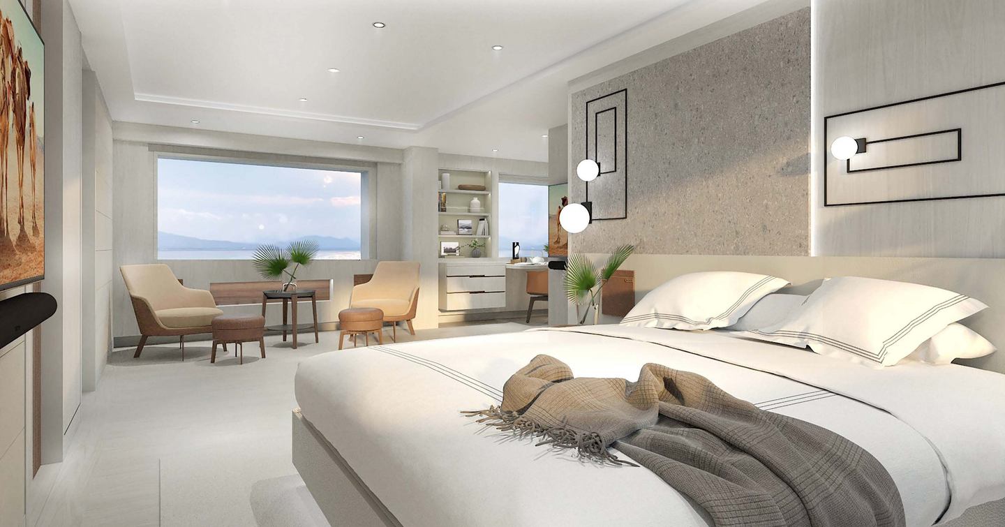 Motor yacht Project Fun's owner's cabin with king sized bed, grey furnishings and seating area