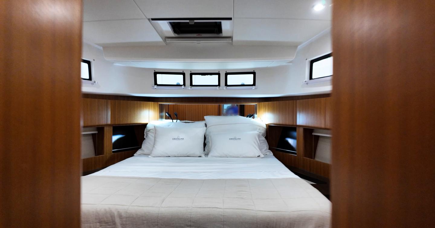 Greenline 42 owner’s cabin forward with double berth and hull glazing
