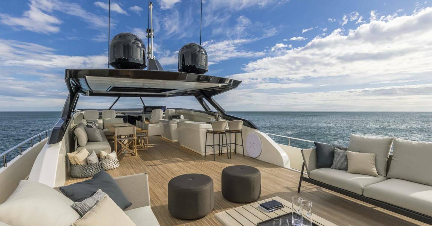 Superyacht Epic's sundeck with alfresco dining and bar area
