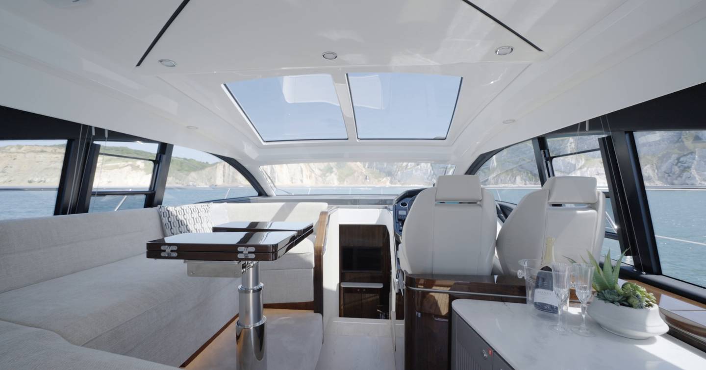 Main deck saloon of the Fairline Targa 47 GT with panoramic glazing and opening sunroof