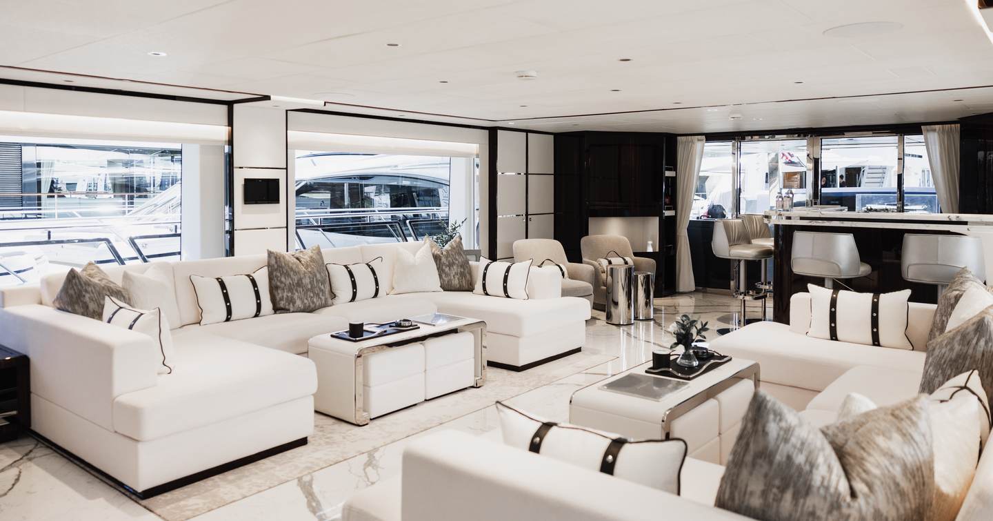 Majesty 120 Superyacht main saloon with U-shaped white sofas 