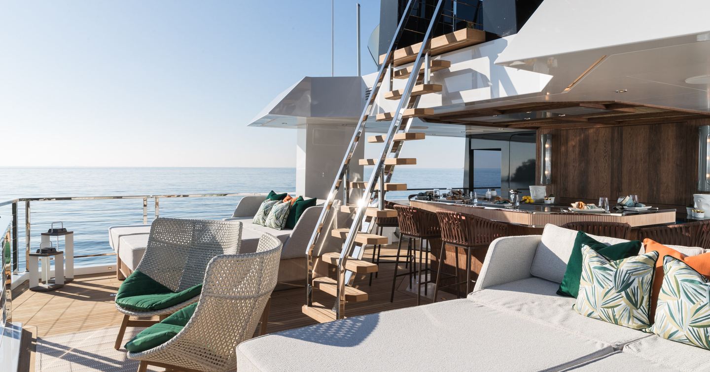 Expedition yacht King Benji aft deck with sunpads and staircase