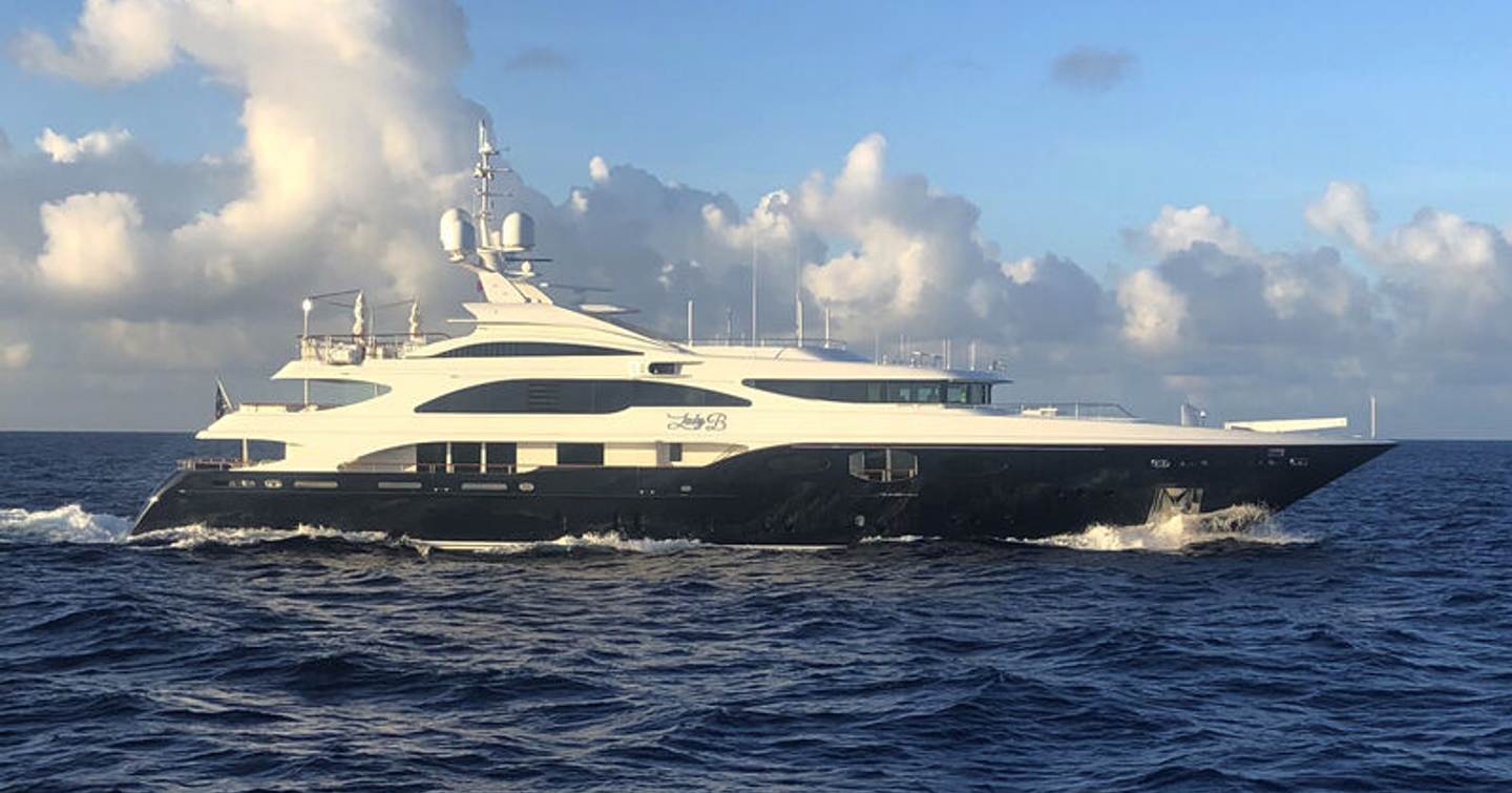 Superyacht Lady B underway, surrounded by sea.