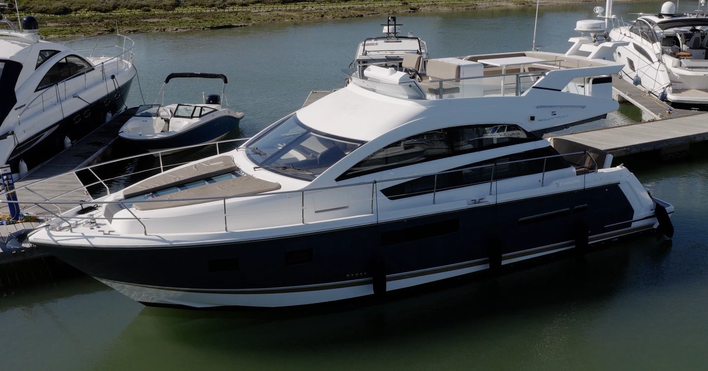 Fairline Squadron 42 in the marina showing foredeck sunpad, flybridge and sidedecks
